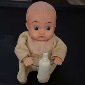 Vintage wind-up Baby Doll with Bottle.